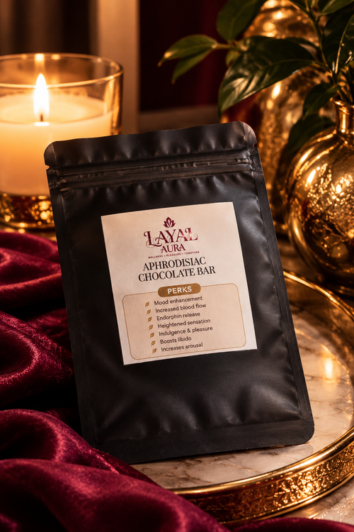 Aphrodisiac chocolate bar in black resealable packaging beside a candle